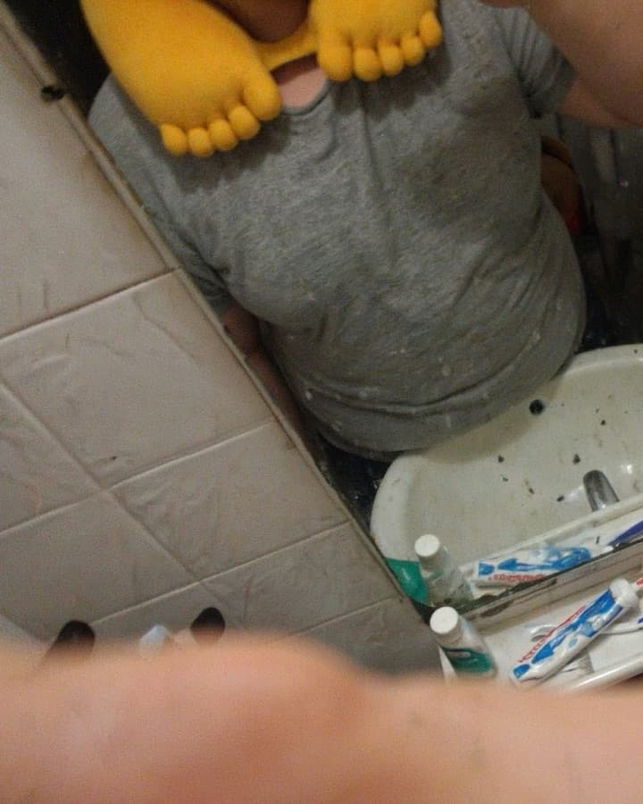 Bathroom mirror selfie wearing the GyatFoot pillow